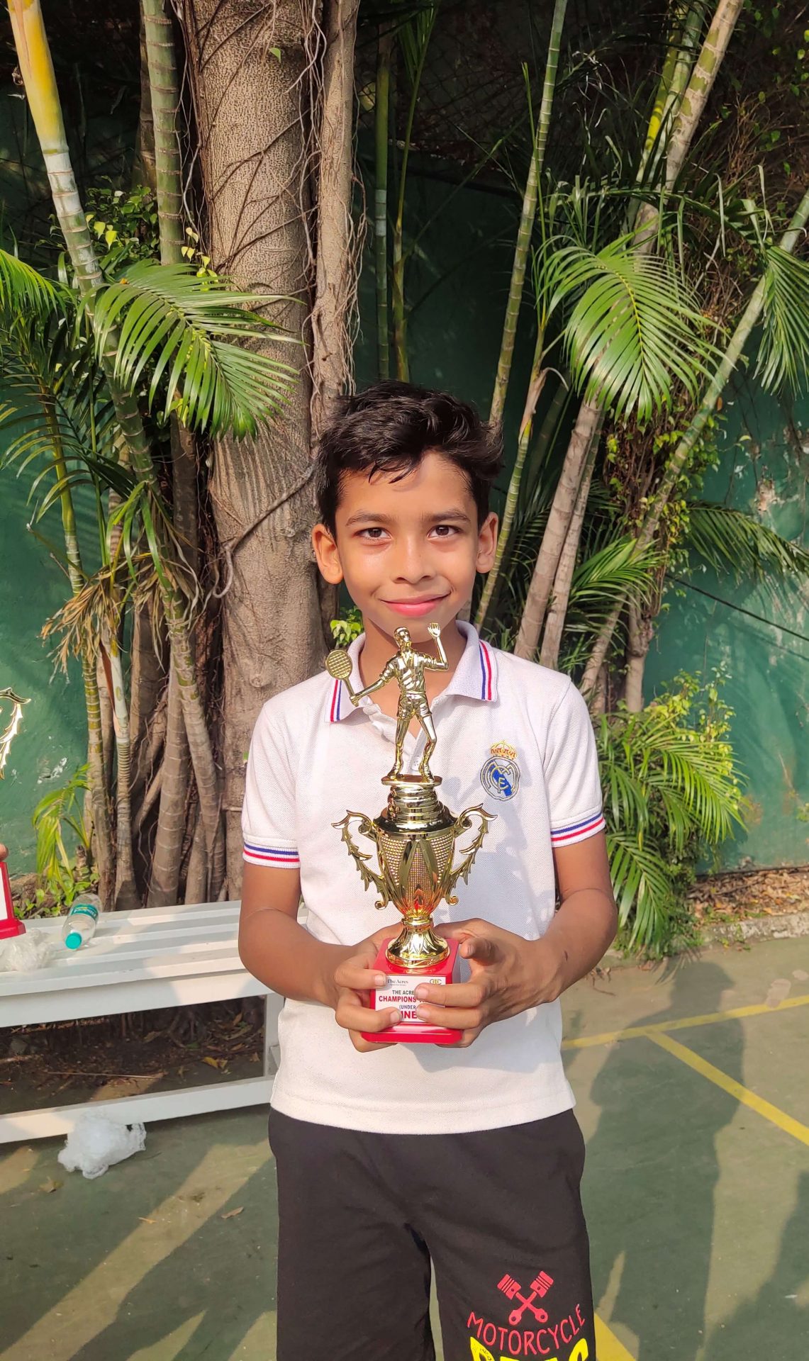 Dishant Borthakur of Grade 4 with Runners up Trophy