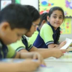 Students reading and learning in a classroom.